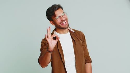 Happy Young Adult Man Gives Approval Sign