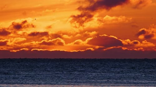 Warm Clouds and Pure Ocean Water at Sunrise Dramatic Sea Sunset