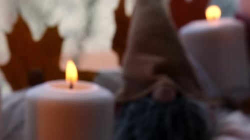 Festive Candles and Gnome Decoration at Night