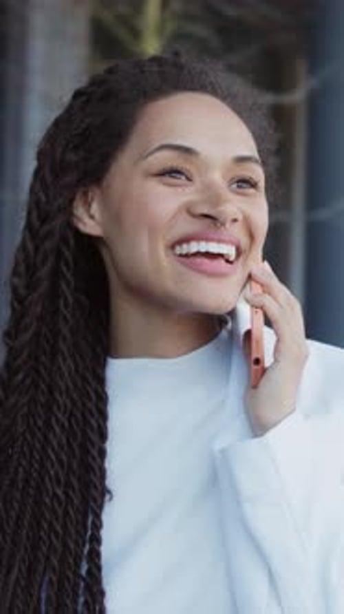 Portrait Happy Smiling Young Woman Sitting Speak on Mobile Phone Relaxing Outdoors on Street Slow