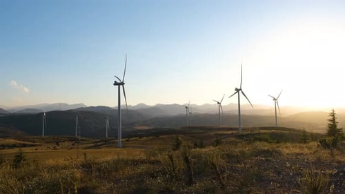 Wind Turbines at Sunset Generating Clean Energy