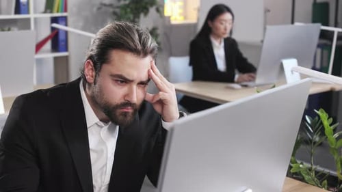 Man Working on Computer at Business Center