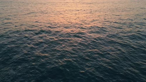 Closeup Sea Water Surface Reflecting Morning Sky. Drone View Calm Ocean Rippling