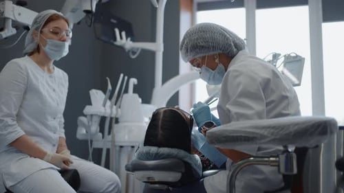 Healthcare Concept Dentist Appointment In Modern Clinic Female Stomatologist Examining Teeth
