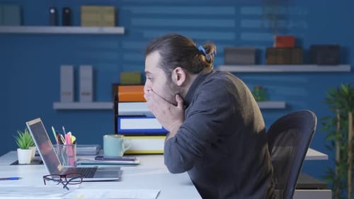 Frustrated young man gets upset and angry.