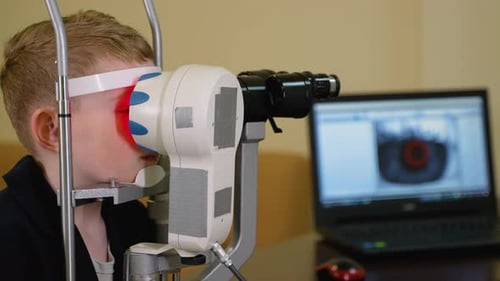Child Patient Undergoing Eye Examination with Modern Medical Equipment