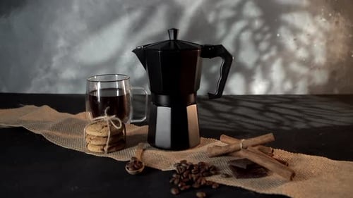 Elegant Espresso Maker with Coffee, Chocolate and Cookies