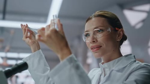 Scientist Examining Test Tube in Laboratory Environment