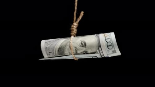 A Twisted Hundred-Dollar Bill Hanging On A Rope In A Tight Noose, Freedom Or Dependence On Money.
