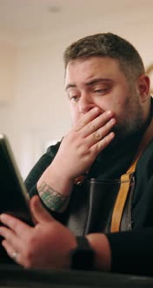 Stress, man and chef with tablet in house for cooking with recipe on mobile food application