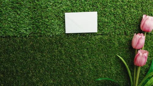 Crafting Invitation with Tulips Flat Lay on Green Grass