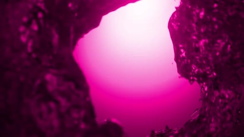 Pink liquid whirlpool vortex creating a swirling tunnel. 3d loop animation 4k