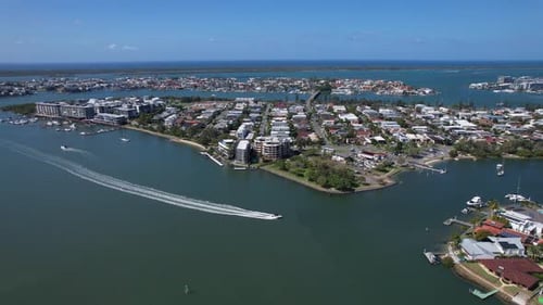 Speedboat Cruising In The Blue Sea Leaving Wake Behind At Paradise Point In Queensland, Australia. -