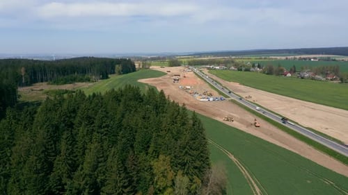 Transformation of Landscapes with a Massive Highway Under Construction.