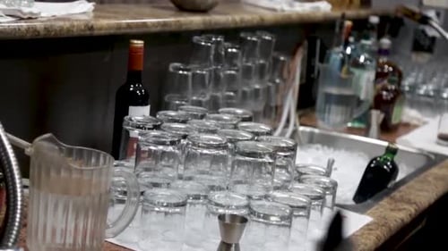 Glasses at a bar about to be used