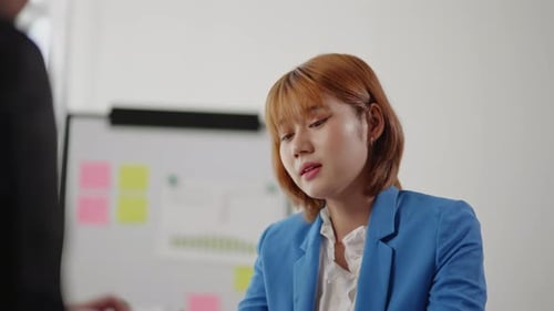 Young Woman at Office Meeting in Workplace
