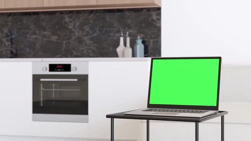 Modern Kitchen with Laptop and Green Screen