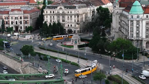 Aerial View of Road Intersection in City Traffic on Roads and Tracks Traditional Trams Providing