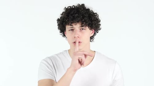 Silence Young Man with Curly Hairs White Background Finger on Lips