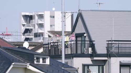 Laundry On Hanger At Clothesline Billowing In The Wind At The Balcony Of A Japanese House In Tokyo,