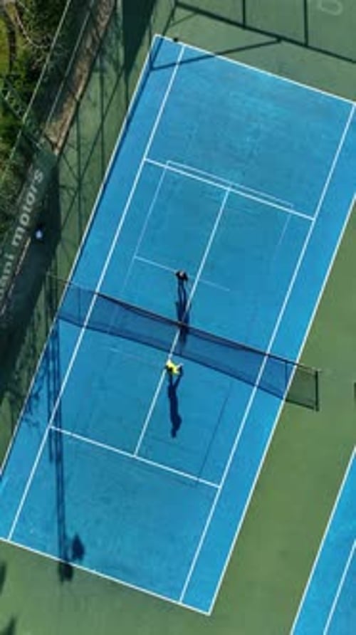 Aerial View of Two Tennis Players Playing Match