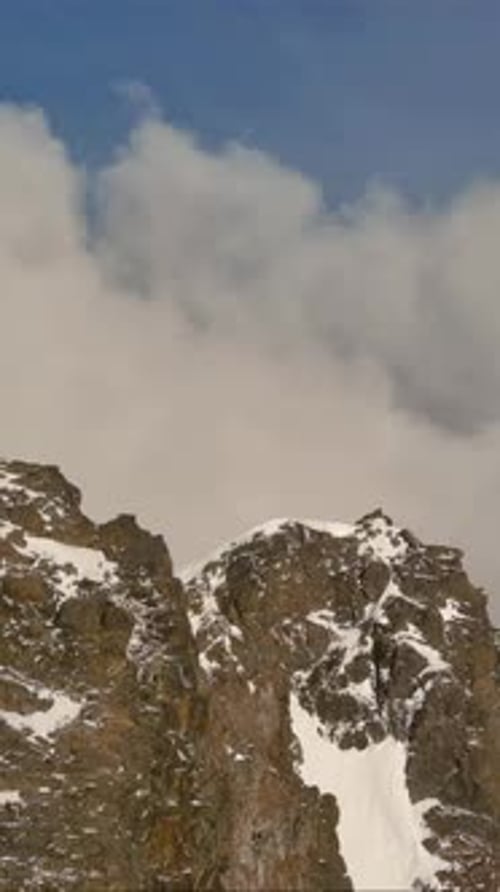 Snowy Mountain Peaks And Clouds. British Columbia, Canada.