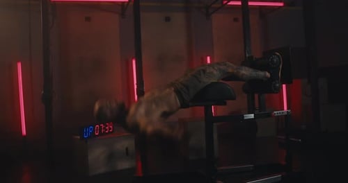 Muscular Man Doing Sit Ups in Gym