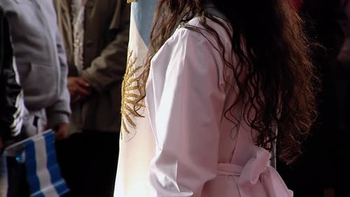 Group gathered around golden sun flag