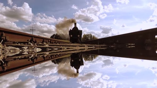 Historical Steam Engine Train Locomotive Driving on Railroad Tracks