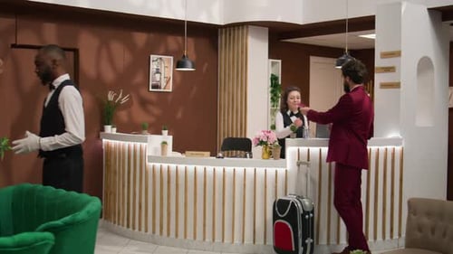 Hotel Guest Checking in at Front Reception Desk