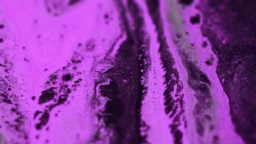 Emulsión rosa de textura colorida con purpurina desenfocada