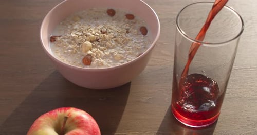 Healthy Breakfast with Oatmeal, Apple, and Juice