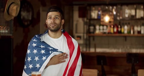 Soccer Fan Sing the National Anthem Before the Game in Sports Bar Sports Games