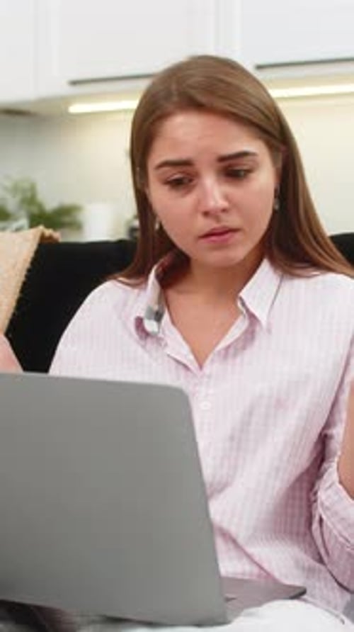 Young Woman Sees Failed Task on Laptop Spreads Hands Unsure Breathes Deep Plans New Approach to Work