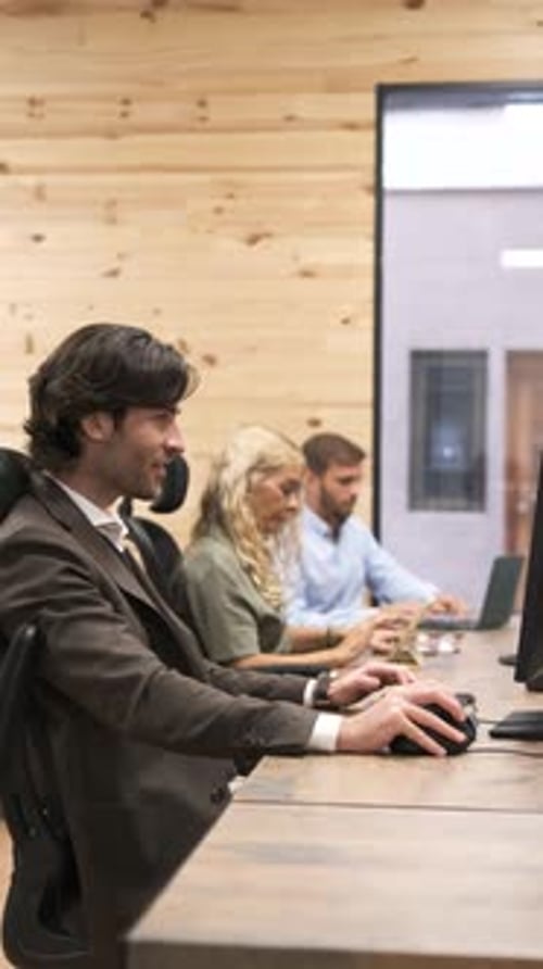 Businessman Smiling Working on Computer at Office Vertical Footage