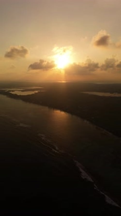 Vertical Aerial Pull-Back Sunset Near Bodden Town