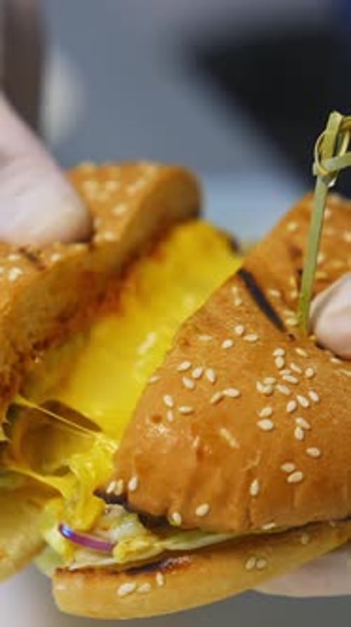 Cheesy Burger Cut into Four Pieces