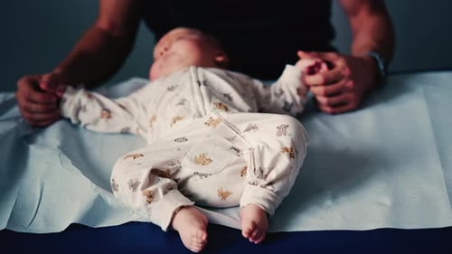 Infant Receiving Treatment from Health Professional at Hospital