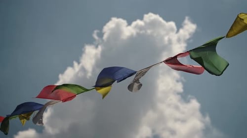 Tibetan Prayer Flags and Blue Sky in Nepal, Colourful Tibetan Prayer Flag Blowing in the Wind at a