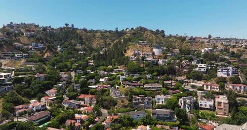 Amazing Aerial View of Luxury Homes in Hollywood Hills, Los Angeles, California. Summer Day. Sliding
