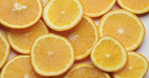 Top Down Background View Made of Fresh Sliced Organic Oranges Closeup