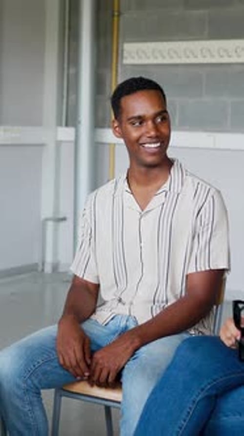 Young Adult Smiling in a Meeting