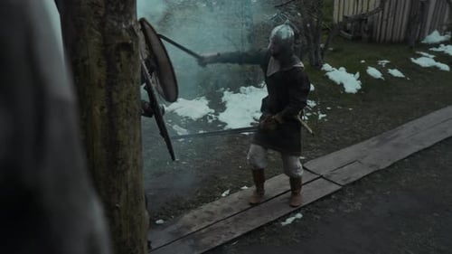 Medieval Warriors in Battle Reenactment with Swords and Shields