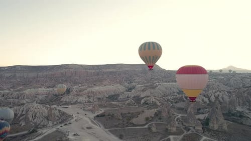 Hot Air Balloons over Rocky Desert Landscape