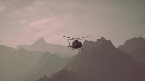 A Helicopter is Flying Over a Mountain Range
