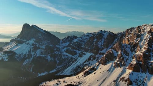 Rocky Snow Mountains at Sunrise Aerial