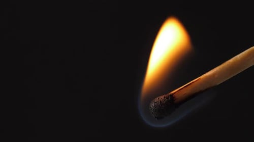 Match Ignites and Burns Brightly in Macro Shot