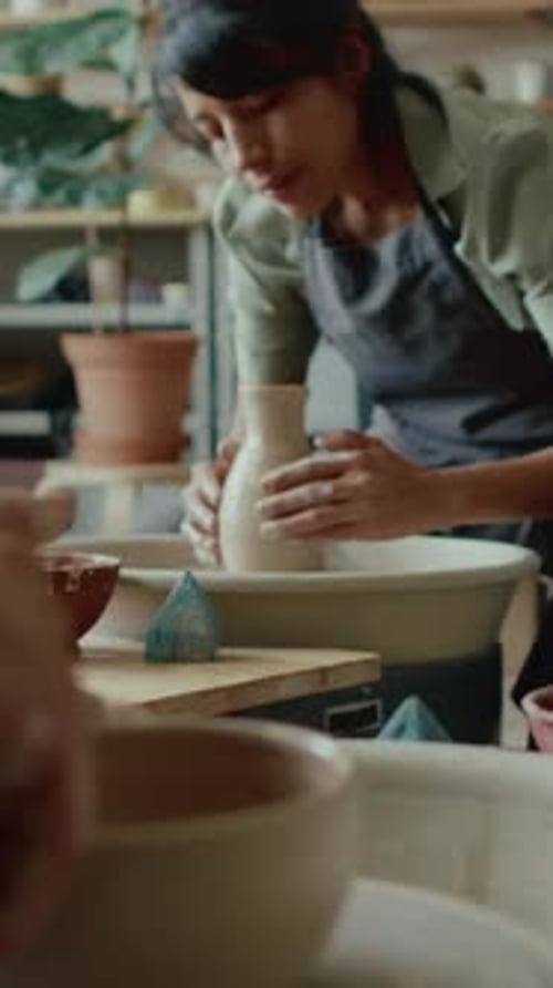 Portrait of Young Latin Craftswoman Working in Potters Studio
