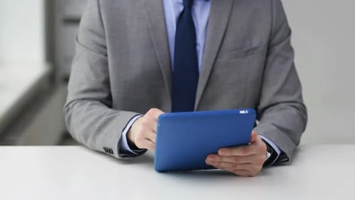 Closeup Of Businessman Hands With Tablet Pc Computer At Office