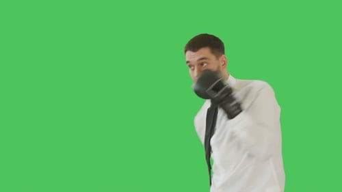 Confident Man in Boxing Gloves Strikes Victorious Pose